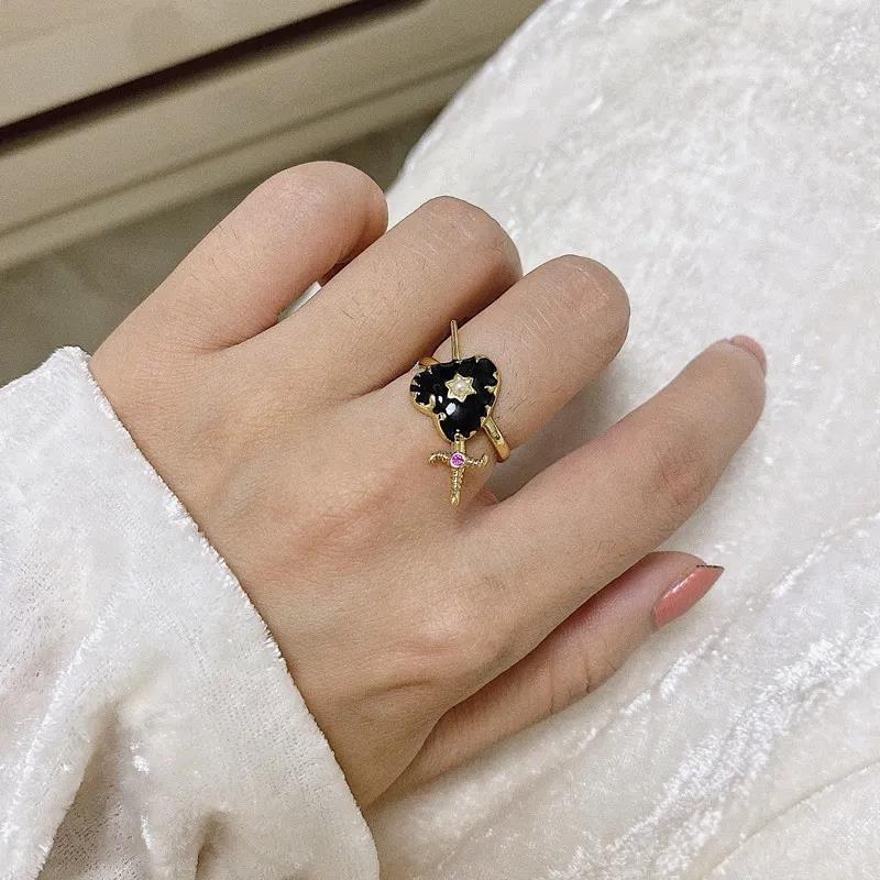 Three-Dimensional Black Heart Ring with Diamonds